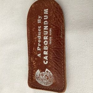 Carborundum vintage sharpening stone with leather case.  Pre-owned.